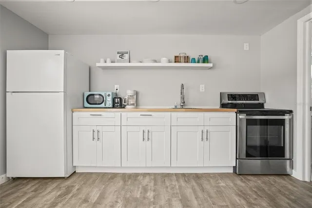 a kitchen with white cabinets