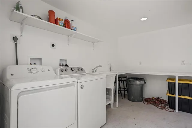 a bedroom with a bed and a chair