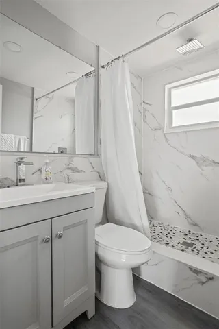 a bathroom with a sink and toilet