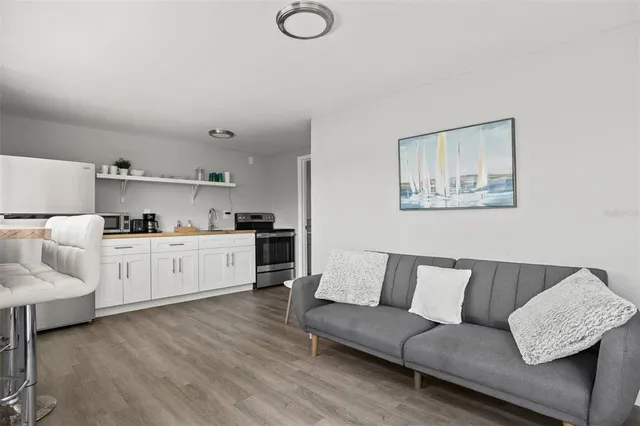 a kitchen with cabinets and stainless steel appliances