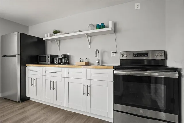 an aerial view of a house with a lake view