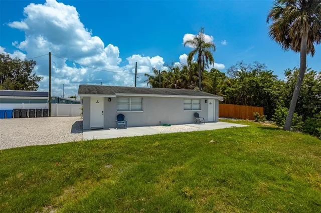 a front view of house with yard and outdoor seating