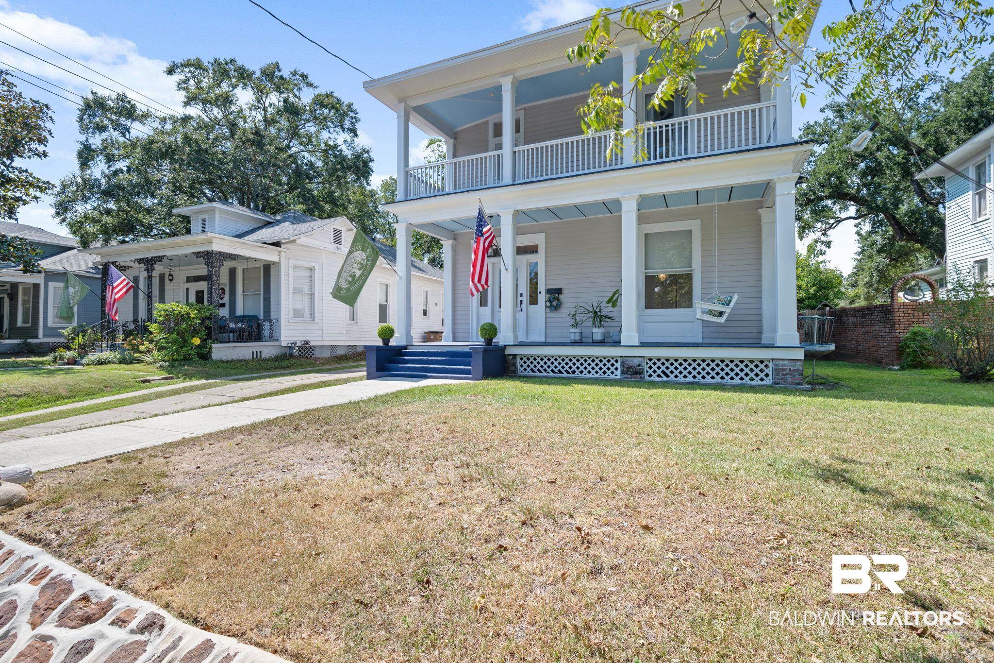 10 South Monterey Street Mobile, AL 36604 - Photo 1 of 45 View of front facade featuring covered porch and a front yard