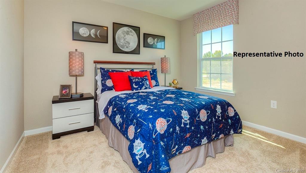 7261 Finnigan Road Charlotte, NC 28215 - Photo 19 of 40 a bedroom with a bed and painting on the wall