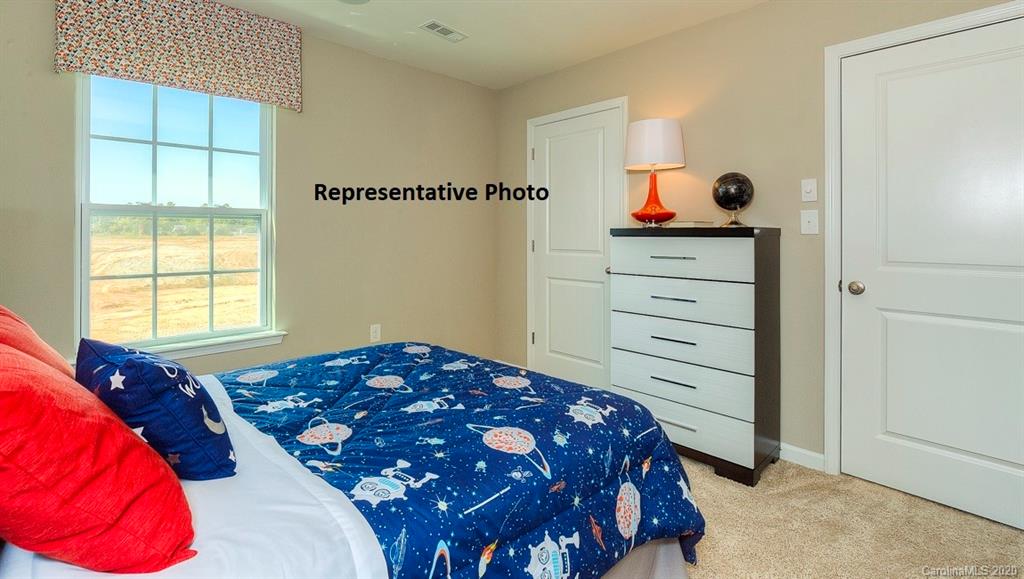 7261 Finnigan Road Charlotte, NC 28215 - Photo 20 of 40 a bedroom with a bed and a window
