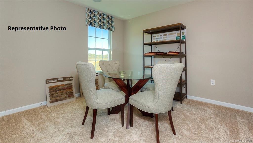 7261 Finnigan Road Charlotte, NC 28215 - Photo 21 of 40 a view of a room with furniture and window