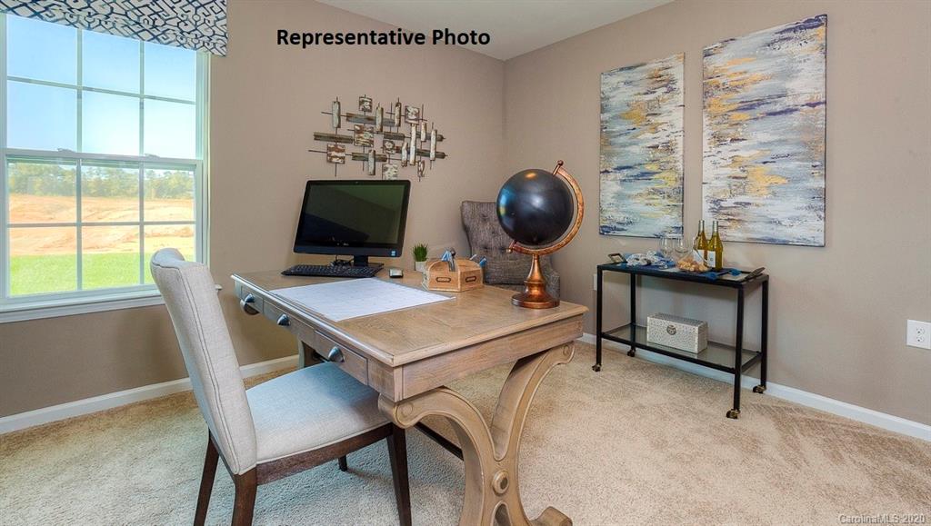 7261 Finnigan Road Charlotte, NC 28215 - Photo 28 of 40 a view of a workspace with furniture and a window