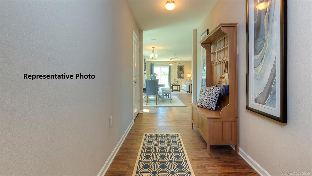 7261 Finnigan Road Charlotte, NC 28215 - Photo 4 of 40 a view of a hallway with a dining area