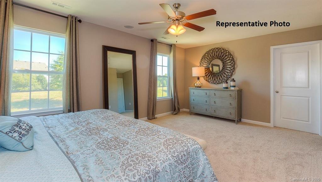 7261 Finnigan Road Charlotte, NC 28215 - Photo 35 of 40 a bedroom with a bed and a window