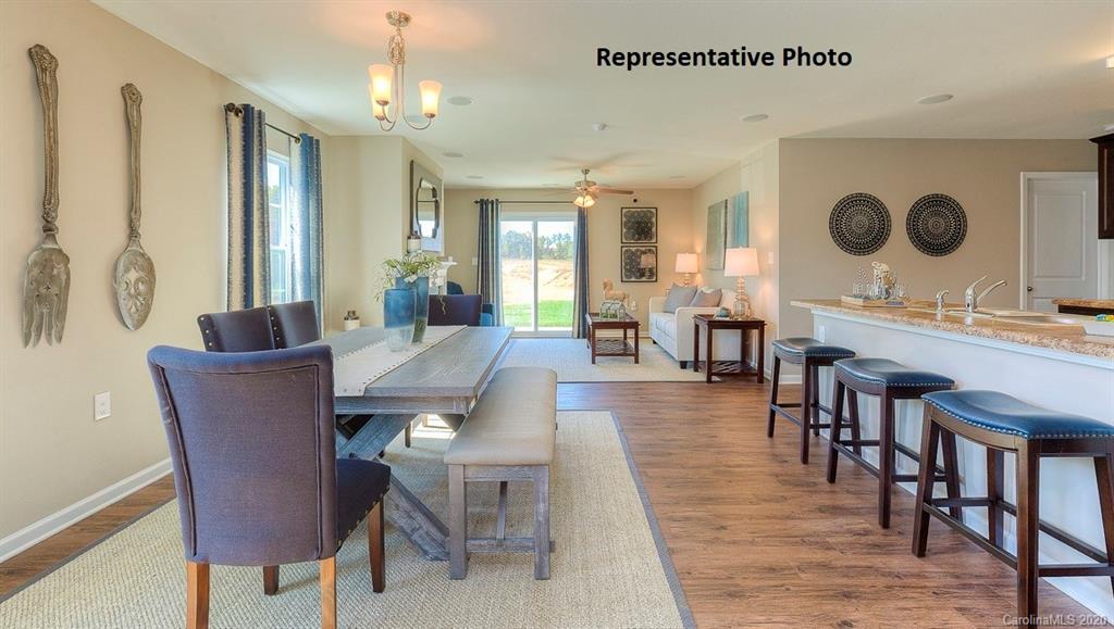 7261 Finnigan Road Charlotte, NC 28215 - Photo 6 of 40 a view of a dining room with furniture and chandelier