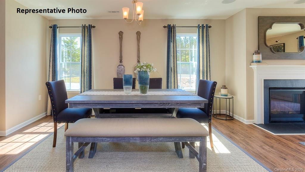7261 Finnigan Road Charlotte, NC 28215 - Photo 8 of 40 a view of a dining room with furniture window and wooden floor