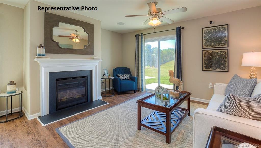 7261 Finnigan Road Charlotte, NC 28215 - Photo 10 of 40 a living room with furniture and a fireplace