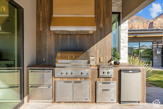 3652 South Cypress Road Hurricane, UT 84737 - Photo 67 of 81 Outdoor kitchen featuring stainless steel grill, range hood, and integrated appliances