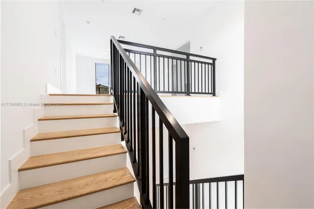 a bathroom with a sink a mirror and a bathtub
