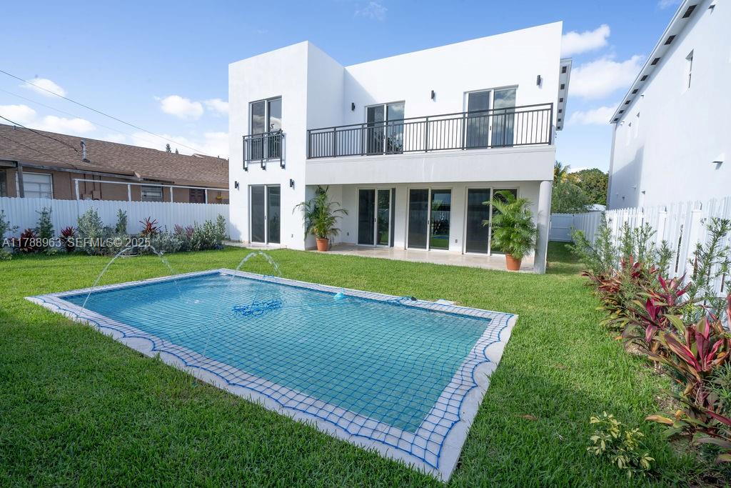 910 Southwest 24th Road Miami, FL 33129 - Photo 2 of 38 a view of an apartment with a backyard