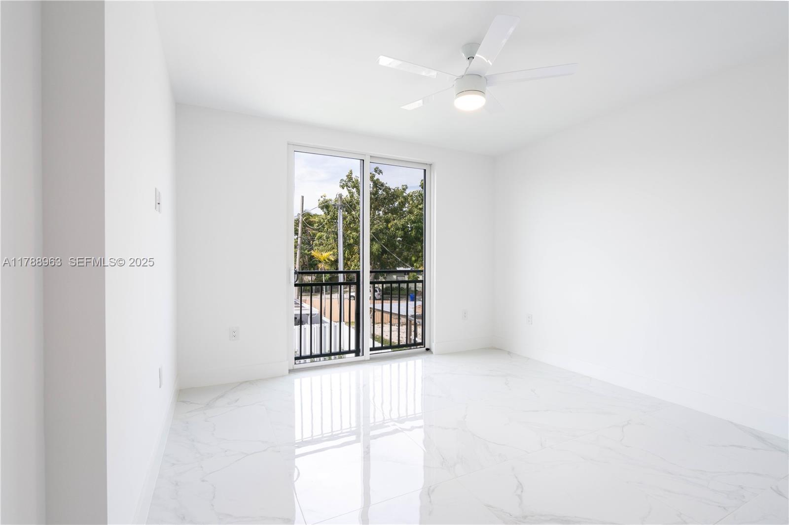 910 Southwest 24th Road Miami, FL 33129 - Photo 26 of 38 a view of an empty room with a window