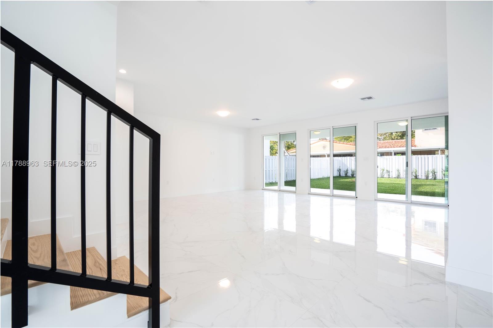 910 Southwest 24th Road Miami, FL 33129 - Photo 7 of 38 a view of an entryway with a floor to ceiling window