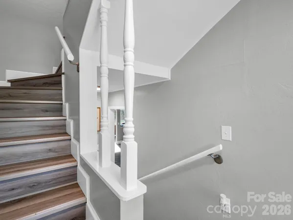 a view of staircase with white walls and white walls