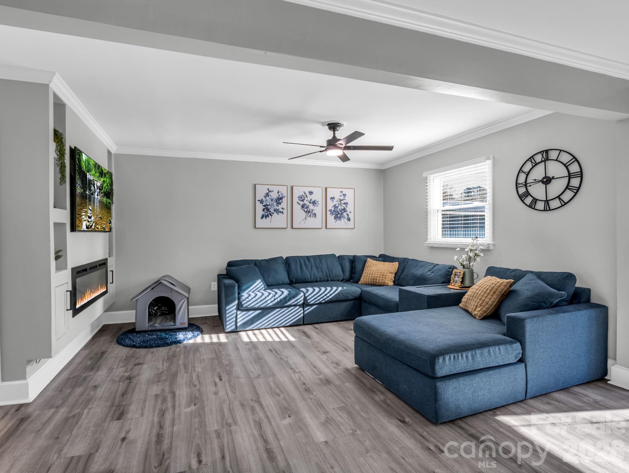151 South Main Street Bostic, NC 28018 - Photo 13 of 45 a living room with furniture and a wooden floor