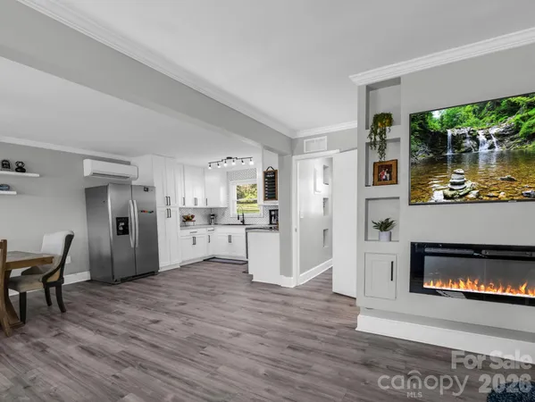 a view of kitchen with furniture and fireplace