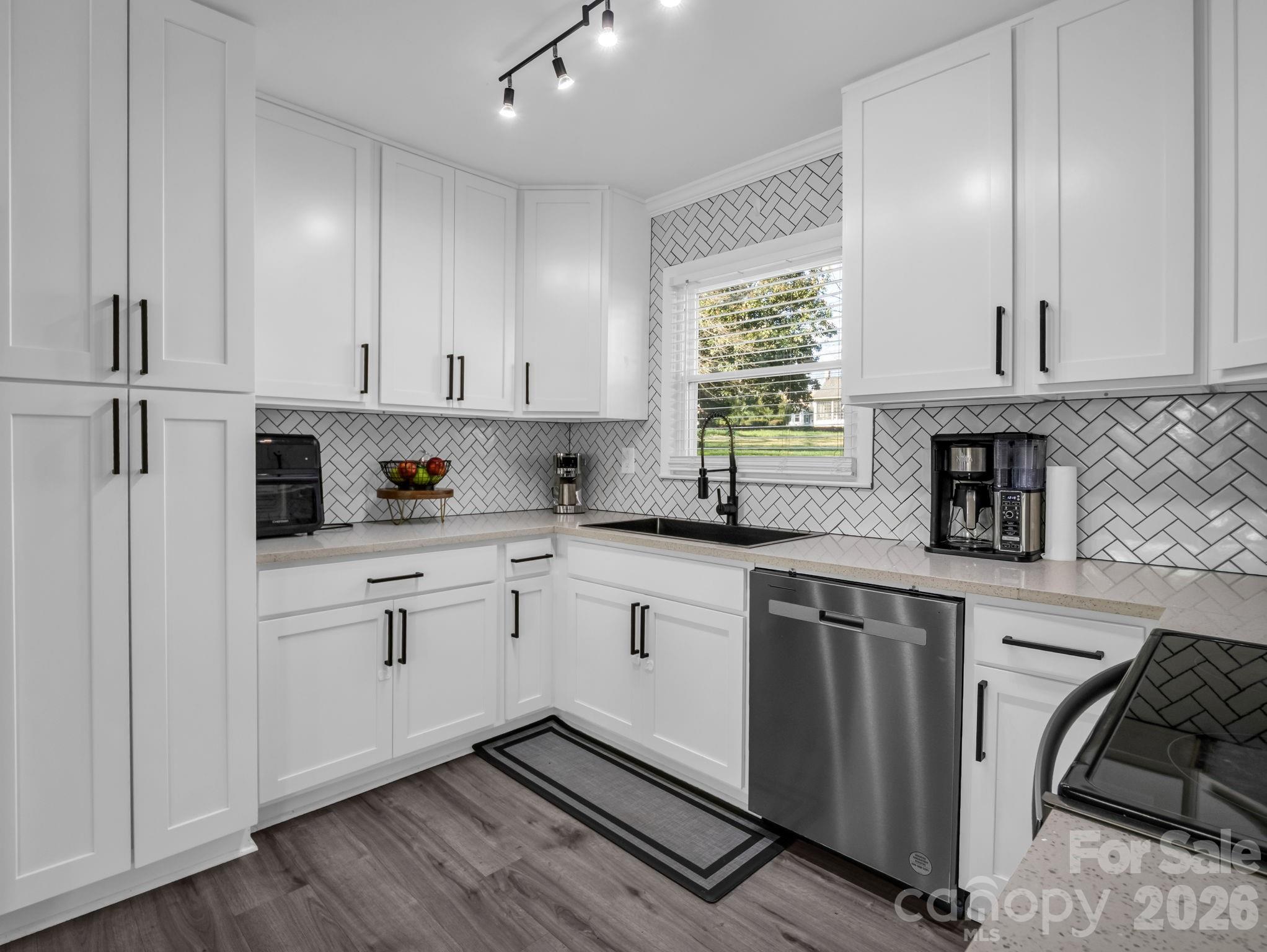 151 South Main Street Bostic, NC 28018 - Photo 19 of 45 a kitchen with stainless steel appliances granite countertop refrigerator sink and cabinets