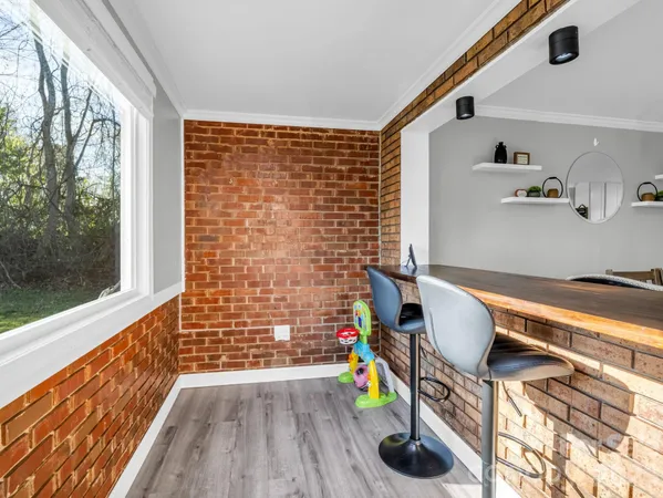 a room with furniture and a wooden floor