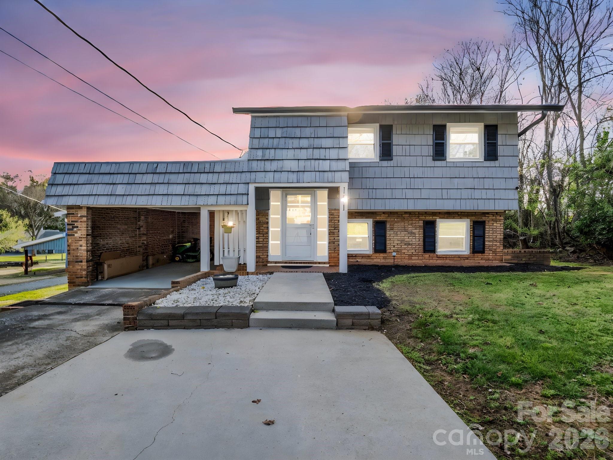 151 South Main Street Bostic, NC 28018 - Photo 3 of 45 a front view of a house with garden