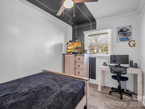 a bedroom with a workspace