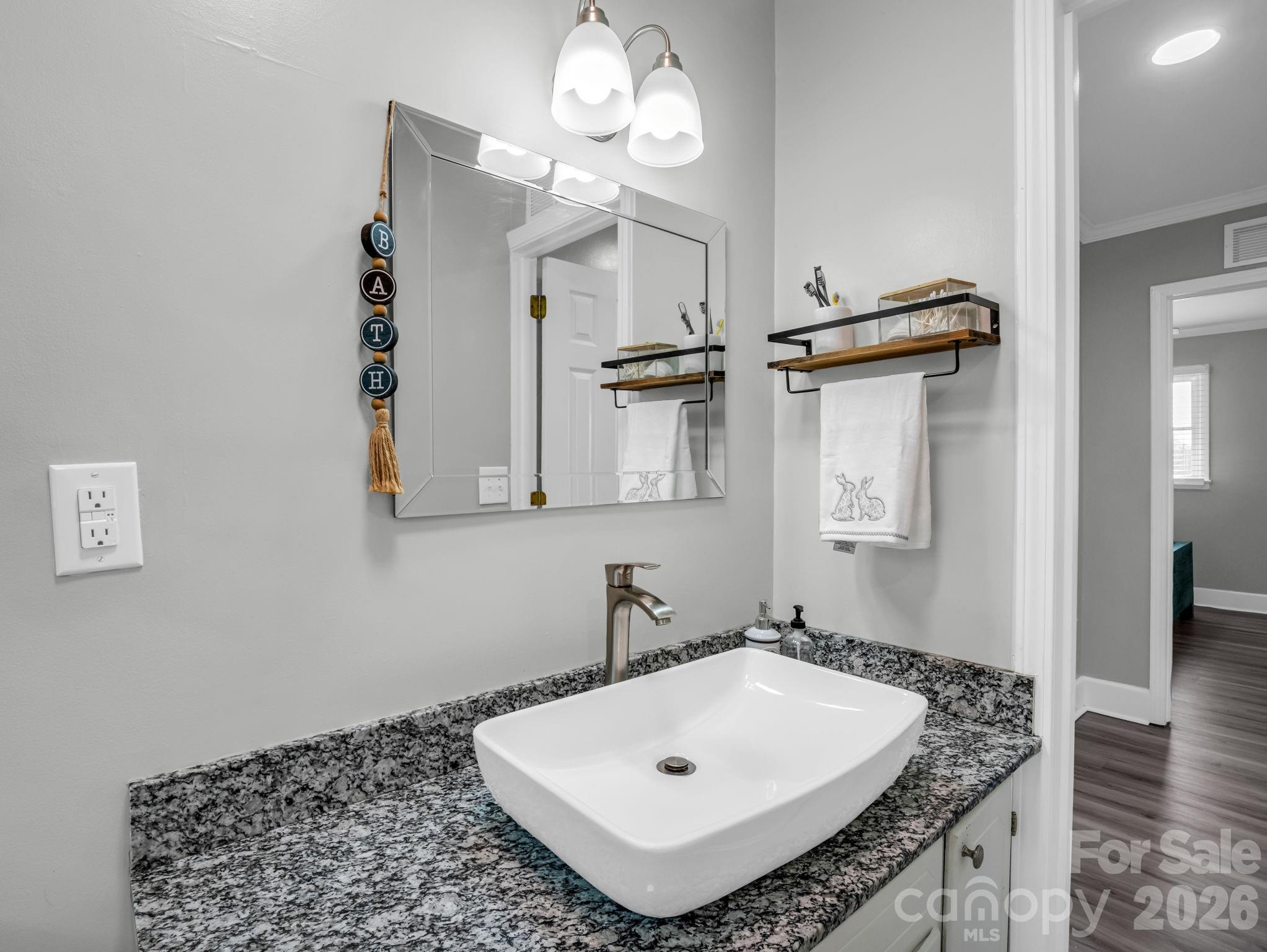 151 South Main Street Bostic, NC 28018 - Photo 33 of 45 a bathroom with a sink a mirror and a shower