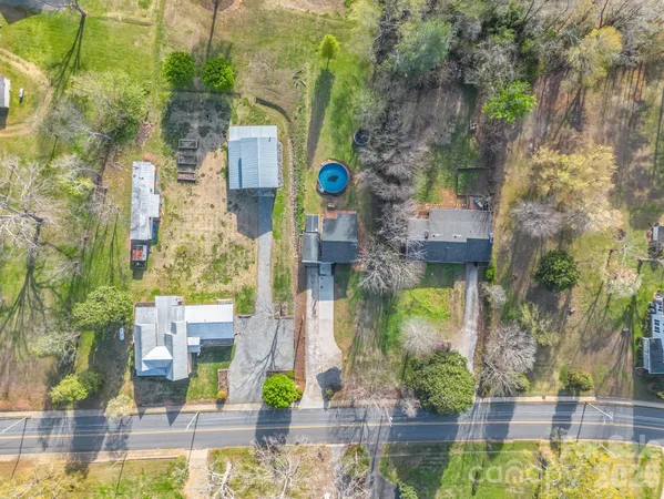 a view of a city with green field