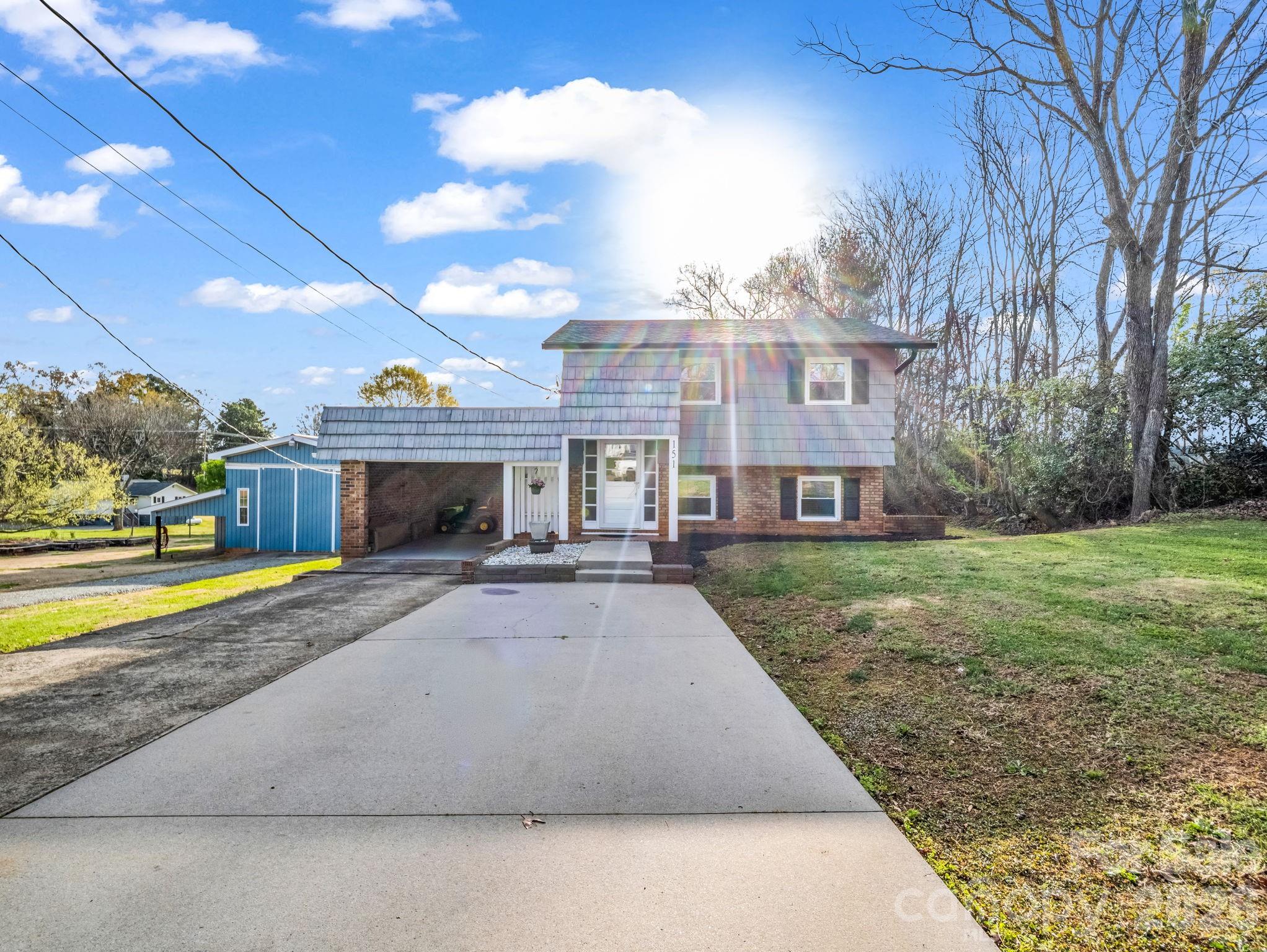 151 South Main Street Bostic, NC 28018 - Photo 5 of 45 a front view of a house with garden