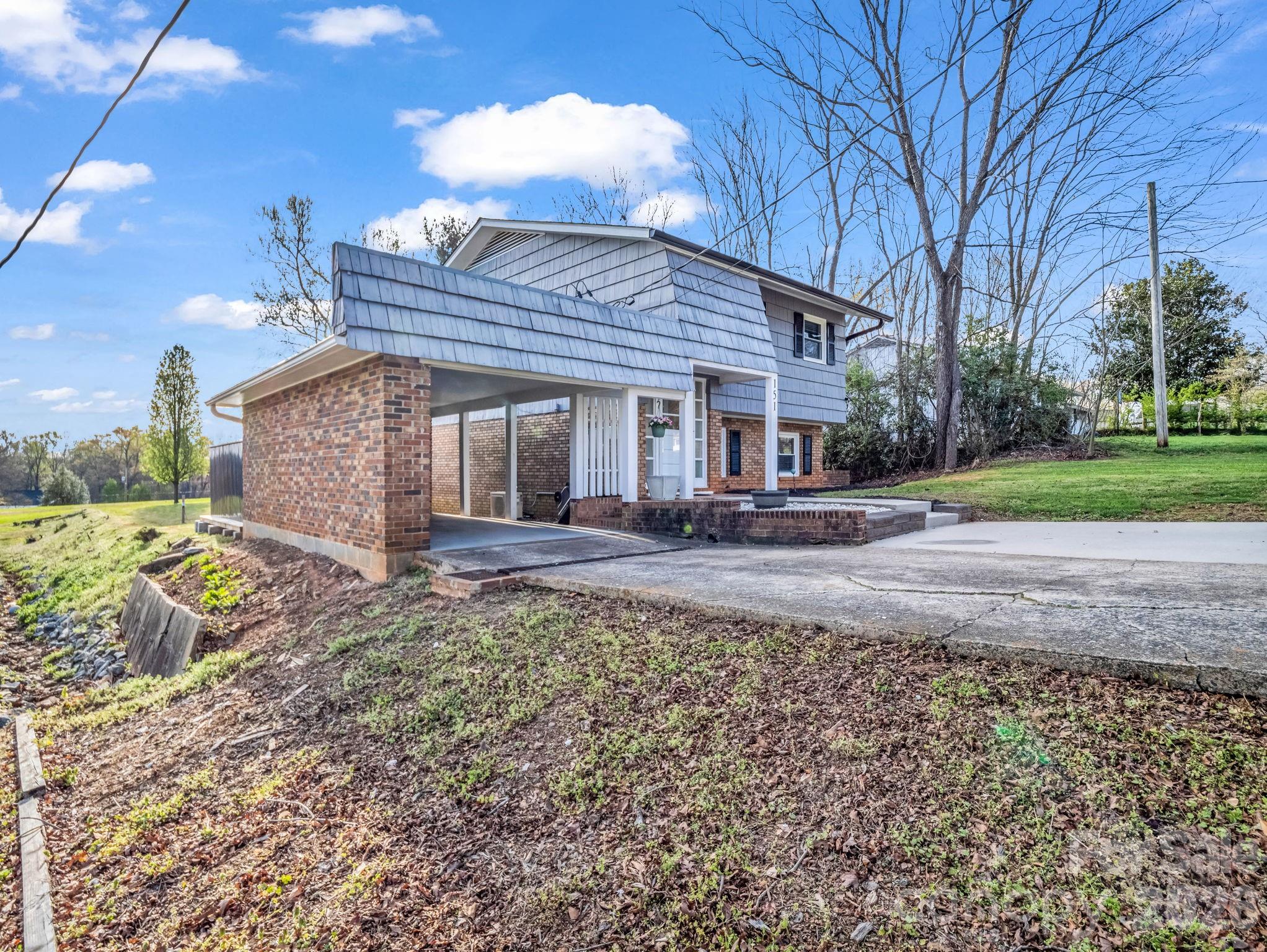 151 South Main Street Bostic, NC 28018 - Photo 6 of 45 a front view of a house with garden