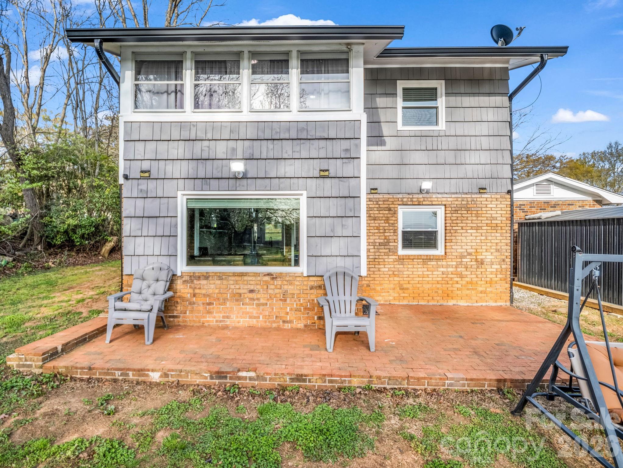 151 South Main Street Bostic, NC 28018 - Photo 10 of 45 a view of a house with backyard and porch