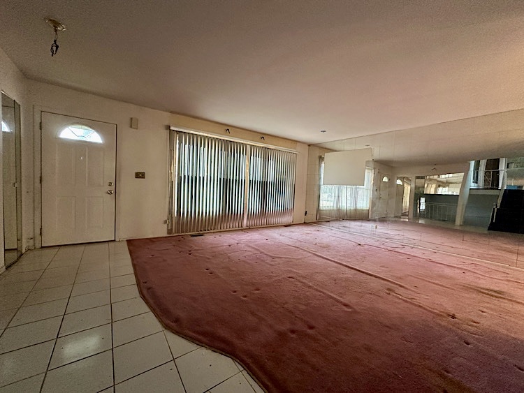 7777 Ramsgate Circle South Hanover Park, IL 60133 - Photo 2 of 26 a view of livingroom with hardwood floor and window