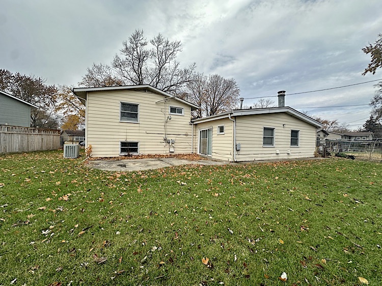 7777 Ramsgate Circle South Hanover Park, IL 60133 - Photo 25 of 26 a view of a house with a backyard