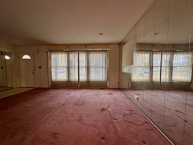 7777 Ramsgate Circle South Hanover Park, IL 60133 - Photo 3 of 26 a view of an empty room with a window