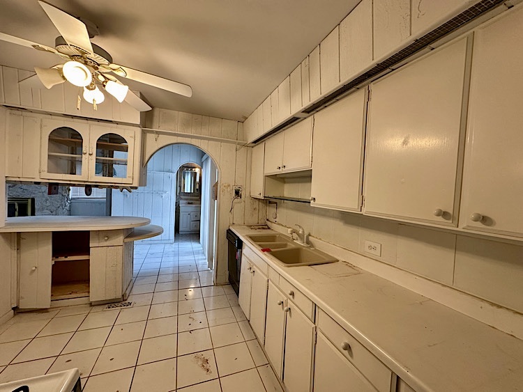 7777 Ramsgate Circle South Hanover Park, IL 60133 - Photo 6 of 26 a kitchen with stainless steel appliances granite countertop a stove a sink and a refrigerator