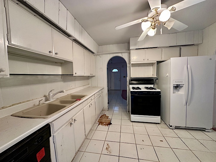 7777 Ramsgate Circle South Hanover Park, IL 60133 - Photo 7 of 26 a kitchen with a sink appliances and cabinets