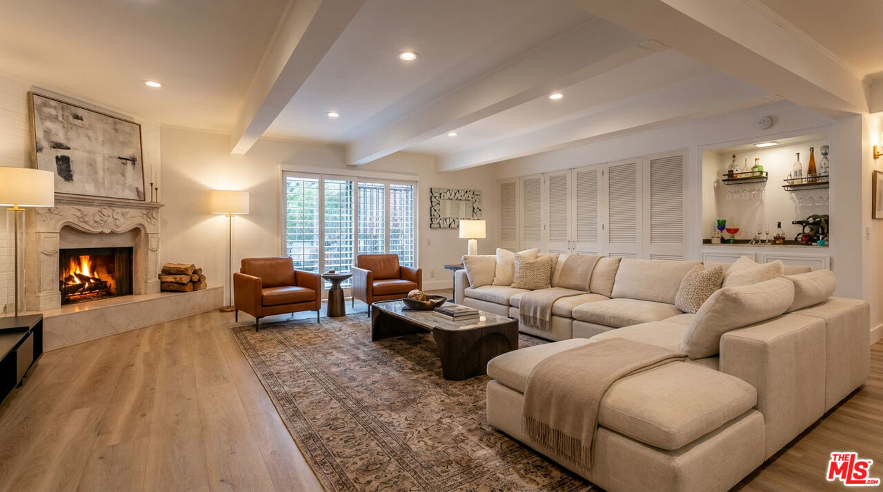 2385 Roscomare Road, Unit D17 Los Angeles, CA 90077 - Photo 1 of 18 a living room with furniture fireplace and a window