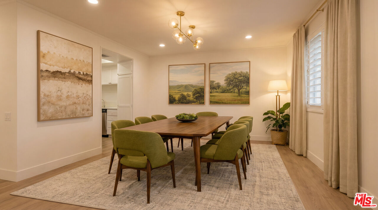 2385 Roscomare Road, Unit D17 Los Angeles, CA 90077 - Photo 11 of 18 a view of a dining room with furniture and a window