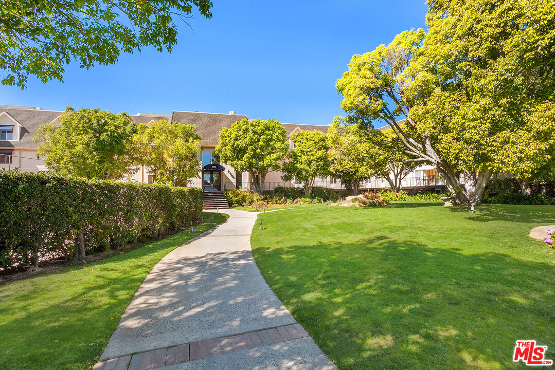 2385 Roscomare Road, Unit D17 Los Angeles, CA 90077 - Photo 15 of 18 a view of building with garden