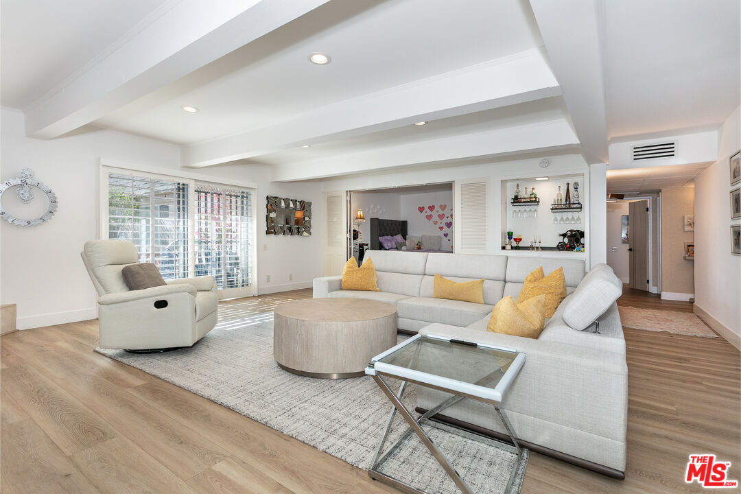 2385 Roscomare Road, Unit D17 Los Angeles, CA 90077 - Photo 3 of 18 a living room with furniture and a large window