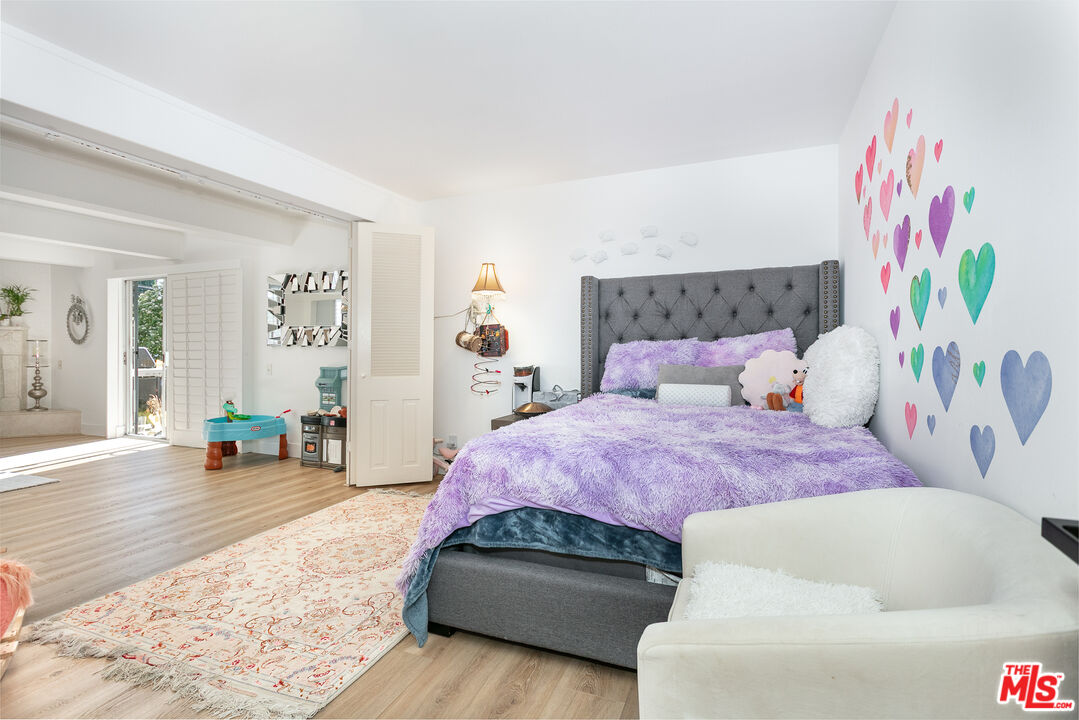 2385 Roscomare Road, Unit D17 Los Angeles, CA 90077 - Photo 6 of 18 a bedroom with furniture and a couch
