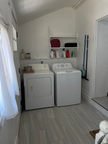 857 27th Street Ogden, UT 84403 - Photo 19 of 20 Dedicated laundry area featuring a washer and dryer, tile flooring, white walls, and built-in shelving