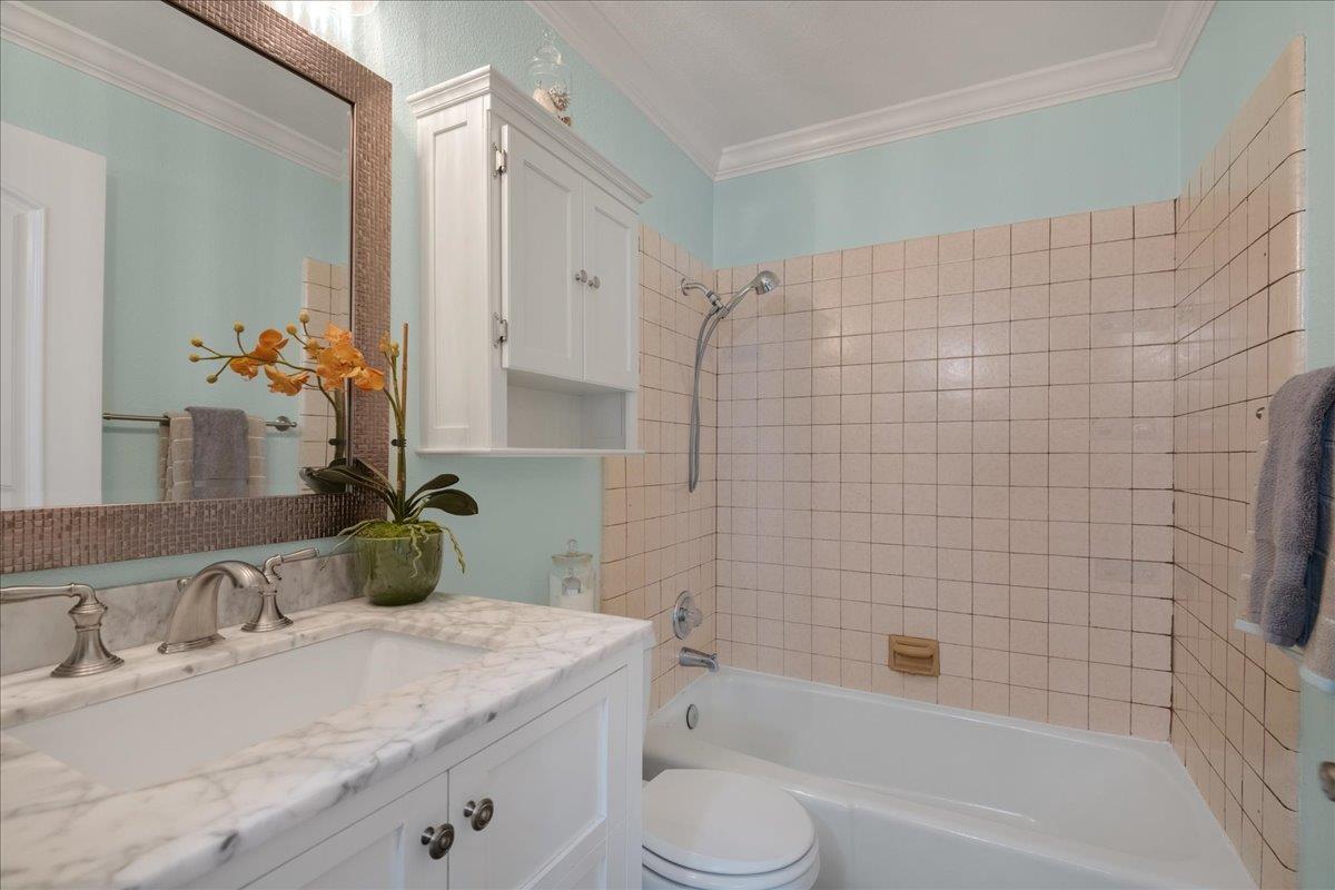 146 Bean Creek Road, Unit E1 Scotts Valley, CA 95066 - Photo 11 of 17 a bathroom with a granite countertop sink toilet and shower