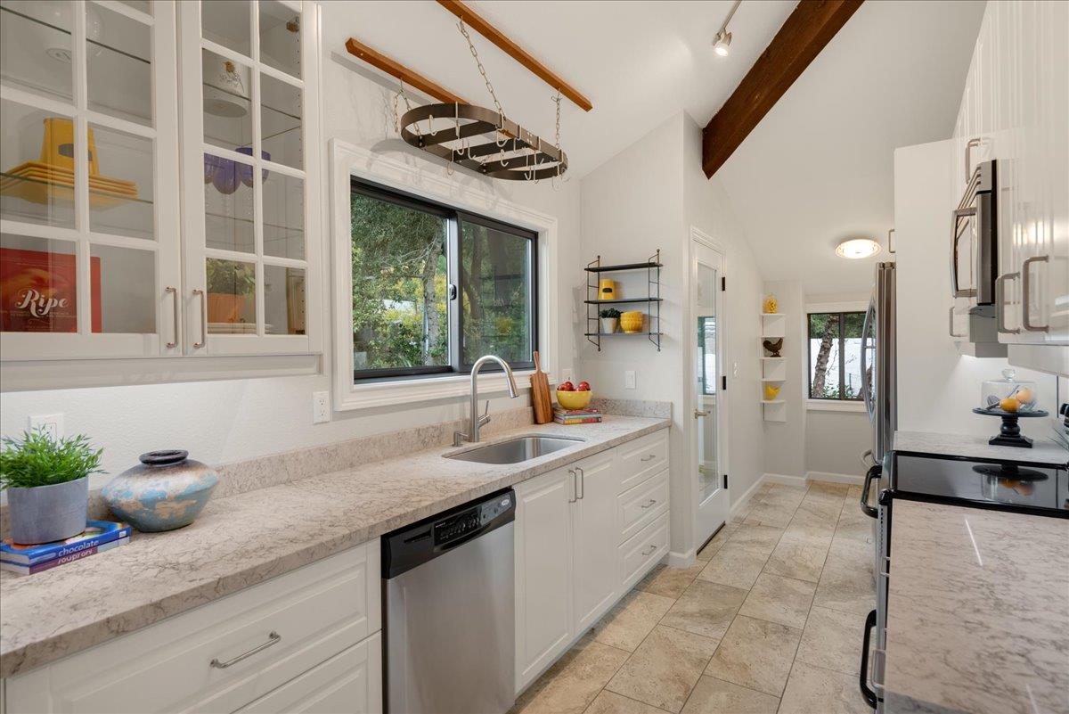 146 Bean Creek Road, Unit E1 Scotts Valley, CA 95066 - Photo 4 of 17 a kitchen with a sink and cabinets