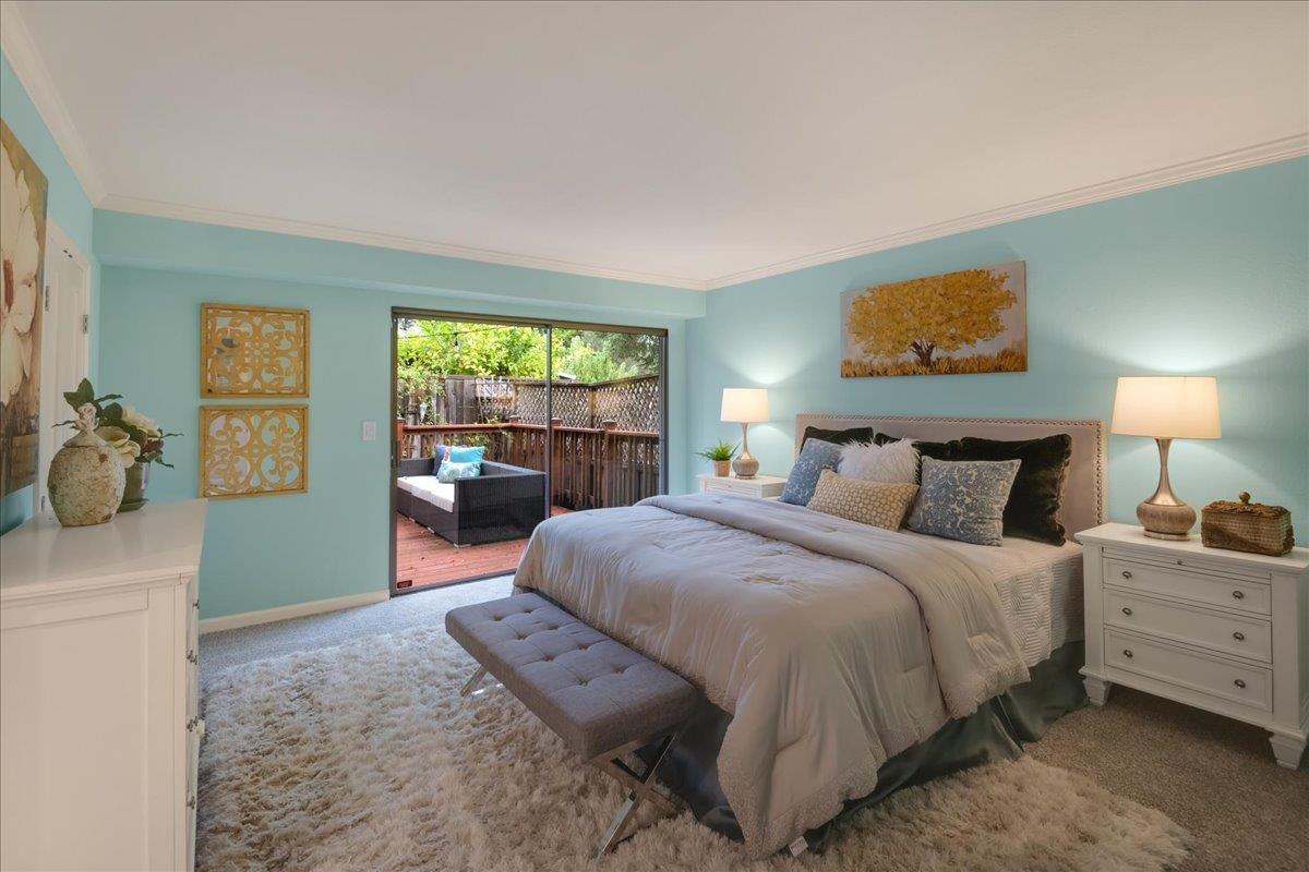 146 Bean Creek Road, Unit E1 Scotts Valley, CA 95066 - Photo 8 of 17 a bedroom with a bed and large windows