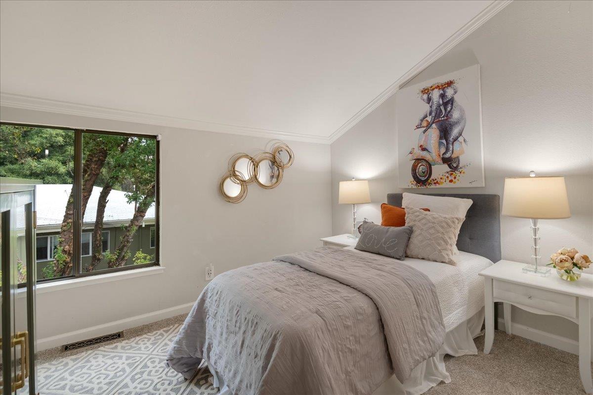 146 Bean Creek Road, Unit E1 Scotts Valley, CA 95066 - Photo 10 of 17 a bedroom with a bed and a large window