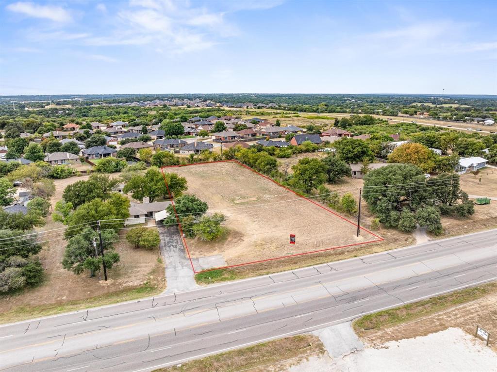 1835 North Main Street Weatherford, TX 76085 - Photo 2 of 7 an aerial view of residential houses with city view