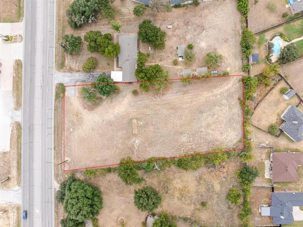 1835 North Main Street Weatherford, TX 76085 - Photo 3 of 7 an aerial view of a house with a yard and a garden